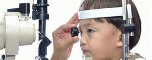 boy having eye exam at Maple Grove Eye Doctors