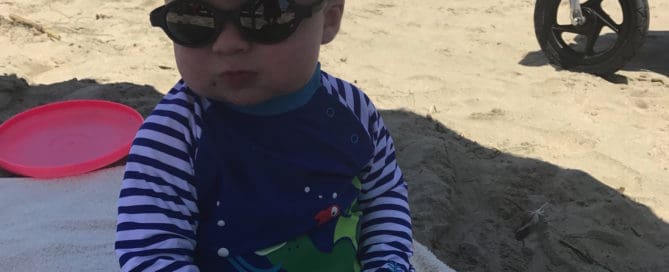 Baby with sunglasses Maple Grove Eye Doctors at Pearle Vision