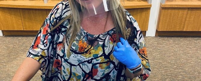 Optician wearing face shield