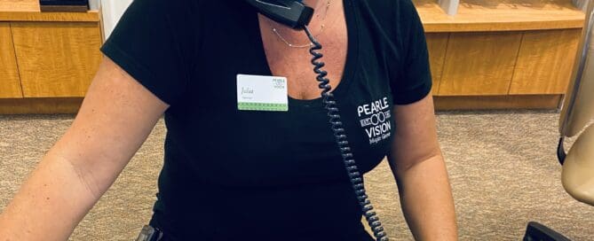 Julia wearing a Covid mask with her glasses Maple Grove Eye Doctors at Pearle Vision