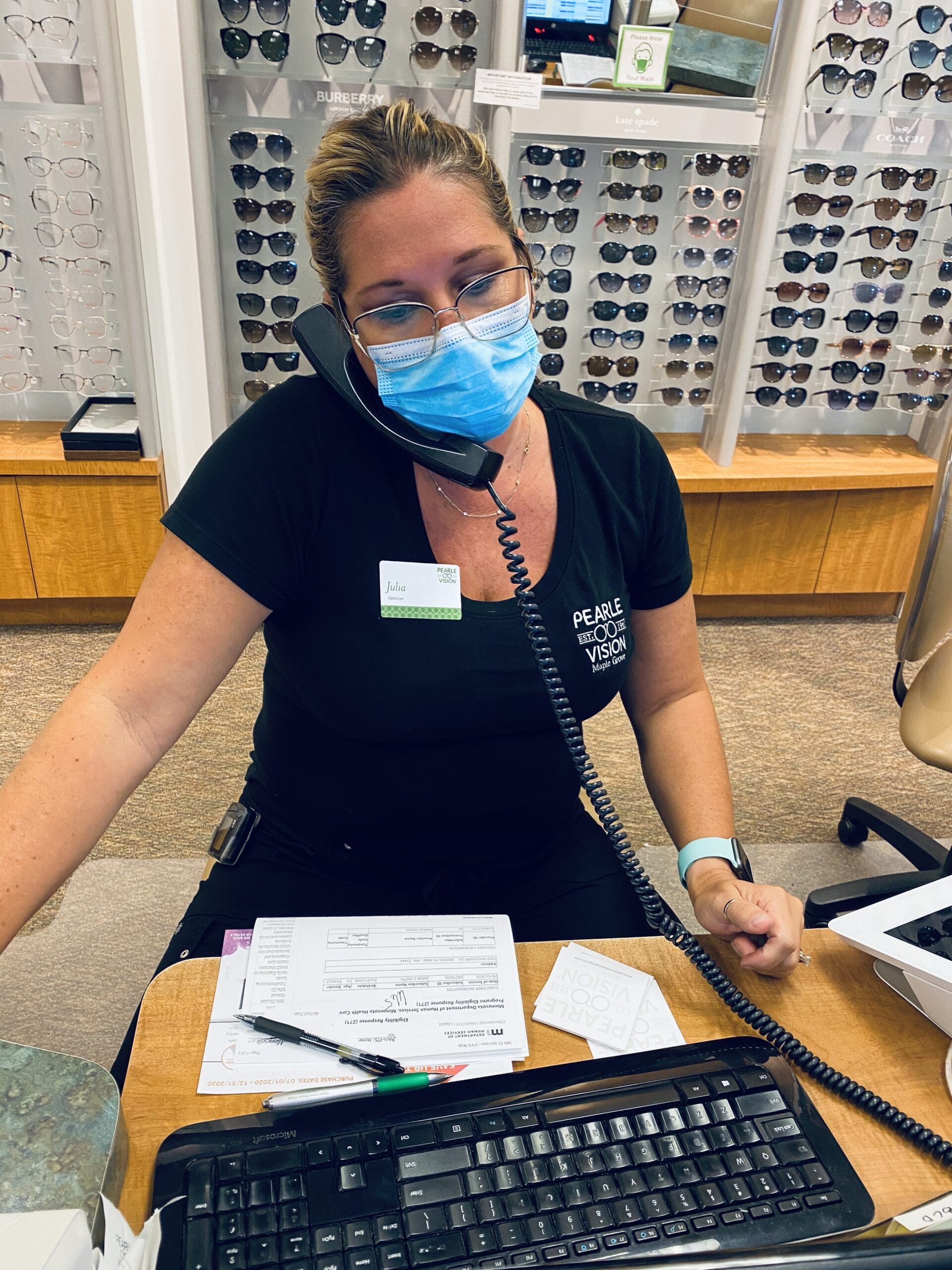 Julia wearing a Covid mask with her glasses Maple Grove Eye Doctors at Pearle Vision