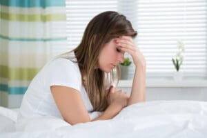 Woman experiencing eye-related headache and vision discomfort