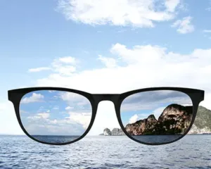 Polarized sunglasses showing clarity of mountain and water Maple Grove Eye Doctors at Pearle Vision